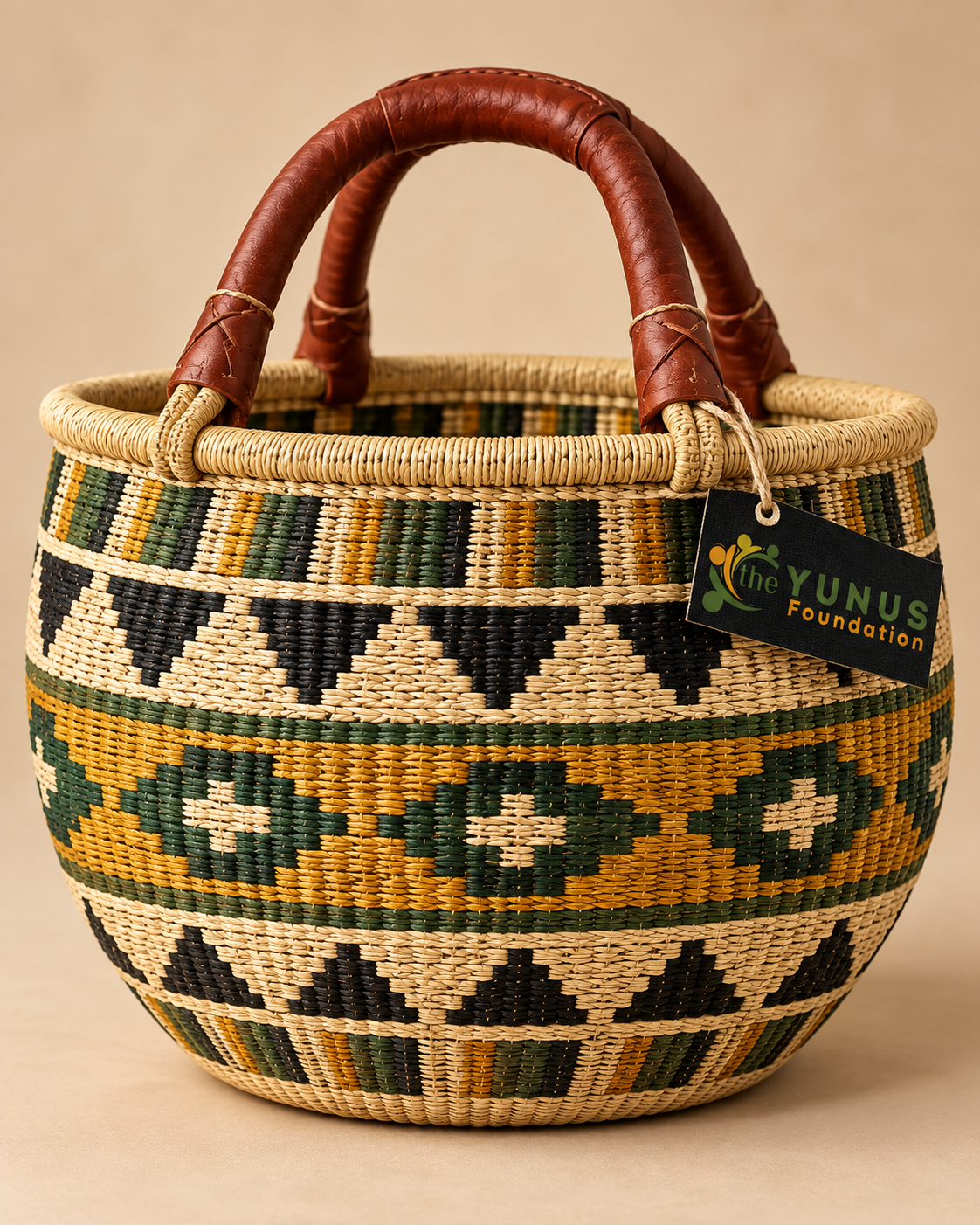 Traditional African Bolga-style woven basket with geometric patterns and leather handles